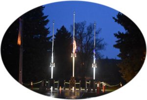 Nighttime East Helena Servicemembers Monument Flags at 1/2 Staff