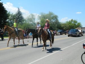 East Helena Valley Rodeo Parade, casual horse riders enjoying their day.