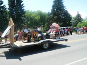 East Helena Valley Rodeo Parade, the East Helena Historical Society float waving hi!