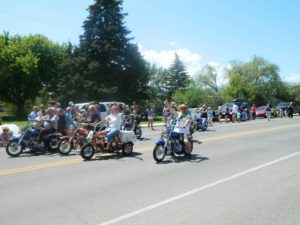 East Helena Valley Rodeo Parade, motorcycle riders with a wave and a smile.